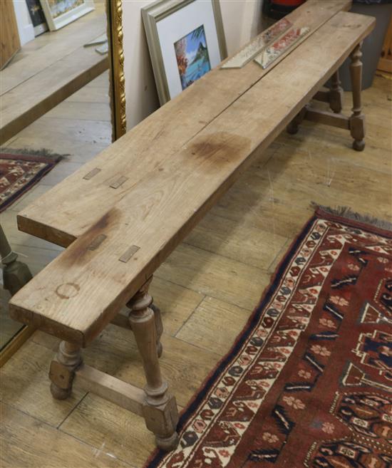 A pair of cherry wood benches W.200cm